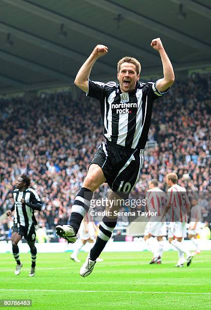 Michael Owen of Newcastle celebrates scoring the opening goal during the Barclays Premier League game between Newcastle United and Sunderland at St...