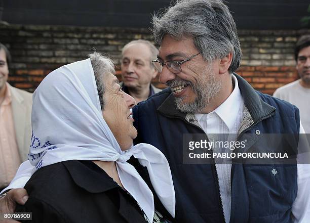 Paraguayan former Catholic bishop Fernando Lugo, presidential candidate of the Alianza Patriotica para el Cambio party, hugs Argentine Hebe de...