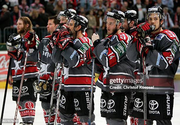 Players of the Koelner Haie look dejected after loosing 1-2 the DEL Play-Offs final match against Eisbaeren Berlin at the Cologne Arena on April 20,...