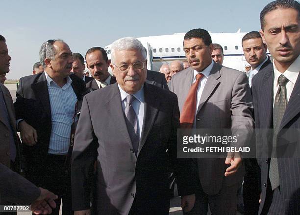 Palestinian leader Mahmud Abbas is surrounded by bodyguards upon his arrival at Tunis-Carthage international airport on April 20, 2008. Abbas arrived...