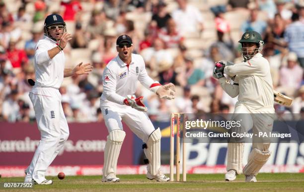 Bangladesh's Tamim Iqbal hits out watched by Ian Bell and Matt Prior during the second test at Old Trafford, Manchester.