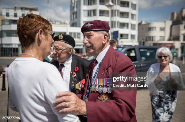 Tom Schaffer who was a paratrooper during the battle of the Ardennes greets people at Worthing Pier, the destination of a convoy of around 90 London...