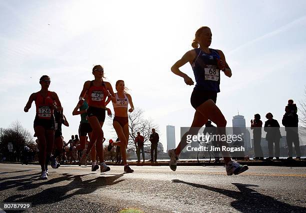 Participants in the U.S. Women's Olympic Marathon Trials run along the Charles River April 20, 2008 in Cambridge, Massachusetts.