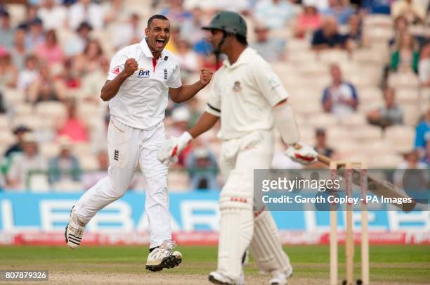 England's Ajmal Shahzad celebrates dismissing Bangladesh's Mohammad Ashraful during the second test at Old Trafford, Manchester.