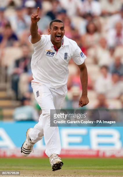 England's Ajmal Shahzad celebrates dismissing Bangladesh's Mohmudullah during the second test at Old Trafford, Manchester.