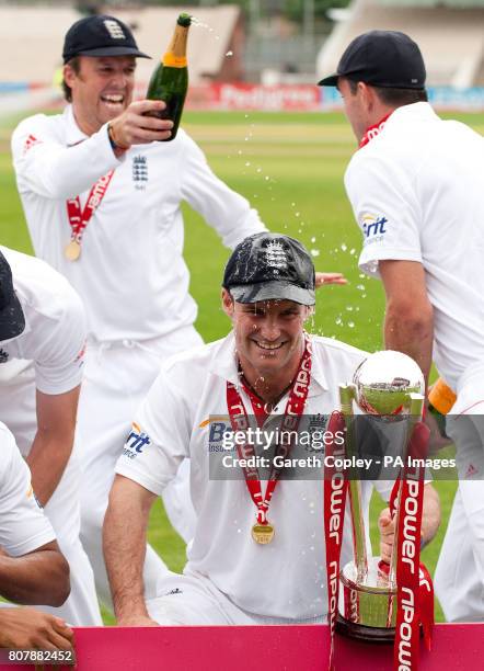 England captain Andrew Strauss celebrates with his team after beating Bangladesh to win the second test at Old Trafford, Manchester.