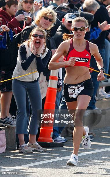 Fan cheers on Magdalena Lewy-Boulet in the U.S. Women's Olympic Marathon Trials run along the Charles River April 20, 2008 in Cambridge,...
