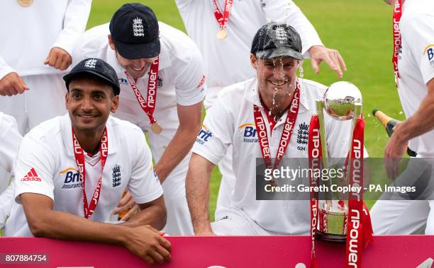 England captain Andrew Strauss celebrates with his team after beating Bangladesh to win the second test at Old Trafford, Manchester.