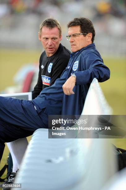 England manager Fabio Capello with coach Stuart Pearce on the touchline during the training match at Moruleng Stadium, Moruleng, South Africa.