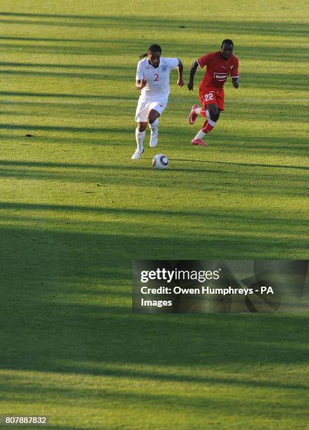 England's Glen Johnson and Platinum Stars' Joseph Mkalipa in action during the training match at Moruleng Stadium, Moruleng, South Africa.