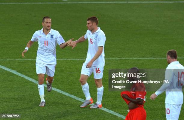 England's Joe Cole celebrates scoring their second goal of the game with teammates during the training match at Moruleng Stadium, Moruleng, South...