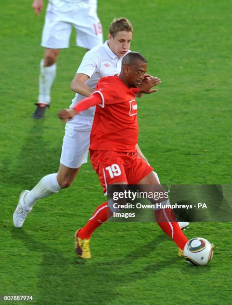 England's Michael Dawson and Platinum Stars' Alton Meiring battle for the ball during the training match at Moruleng Stadium, Moruleng, South Africa.