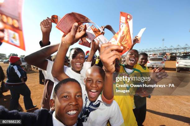 Young football fans gather outside the stadium, prior to the training match at Moruleng Stadium, Moruleng, South Africa.