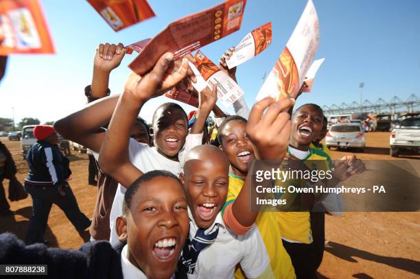 Young football fans gather outside the stadium, prior to the training match at Moruleng Stadium, Moruleng, South Africa.