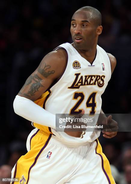 Kobe Bryant of the Los Angeles Lakers runs up court during the second quarter against the Denver Nuggets in Game One of the Western Conference...