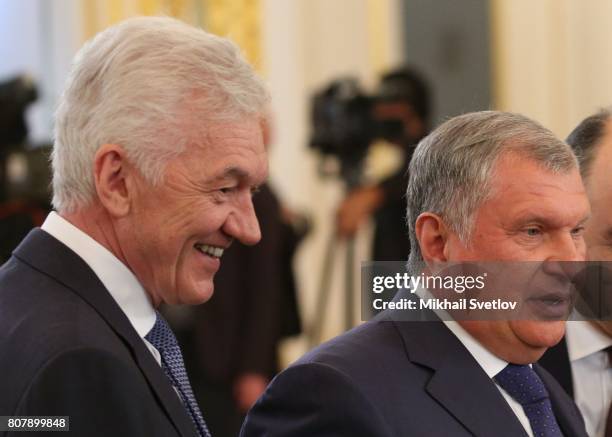 Russian businessmen: Gennady Timchenko and Igor Sechin attend Russia-China talks between Russian President Vladimir Putin and Chinese President Xi...