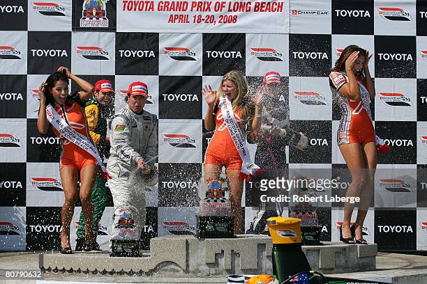 Will Power of Australia, driver of the KV Racing Technology DP01 Ford Cosworth, Mario Dominguez of Mexico and Franck Montagny of France celebrate...
