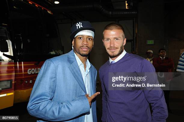 Allen Iverson of the Denver Nuggets poses with MLS player David Beckham of the Los Angeles Galaxy after Game One of the Western Conference...
