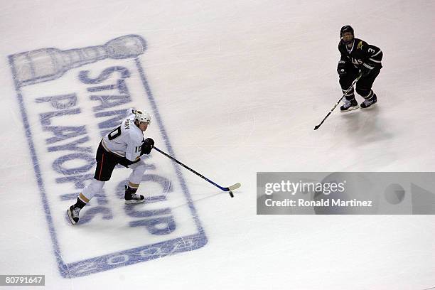 Right wing Corey Perry of the Anaheim Ducks skates the puck against Stephane Robidas of the Dallas Stars during Game Six of the 2008 NHL Western...