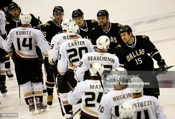 Niklas Hagman of the Dallas Stars shakes hands with Francois Beauchemin of the Anaheim Ducks after winning the series 4-2 in Game Six of the 2008 NHL...