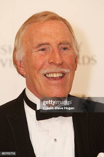 Presenter Sir Bruce Forsyth poses in front of the winners boards at the British Academy Television Awards 2008 supported by Sky+ at the Palladium on...
