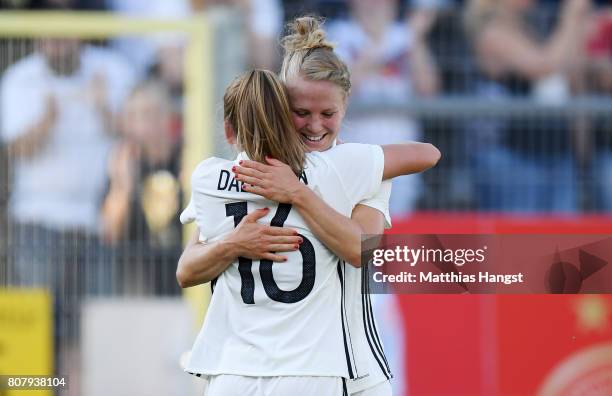 Leonie Maier of Germany celebrates with her team-mates after scoring her team's third goal during the Women's International Friendly match between...