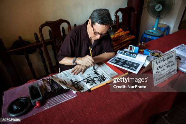 Man practices Vietnamese calligraphy in the city of Hanoi in the north of Vietnam on 5 June 2017. Hanoi, is the capital of the Democratic Republic of...