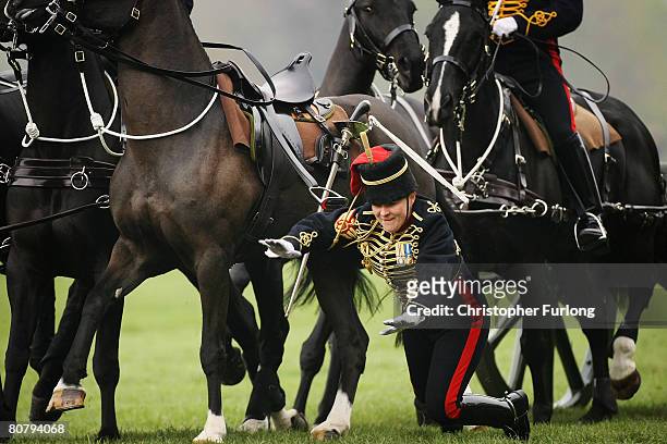 Young gunner falls from her mount during the gallop as part of a 41 gun royal salute by The Kings Troop Royal Horse Artillery in Hyde Park on April...