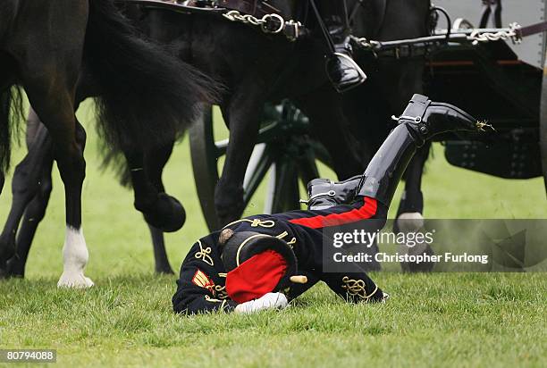 Young gunner falls from her mount during the gallop as part of a 41 gun royal salute by The Kings Troop Royal Horse Artillery in Hyde Park on April...