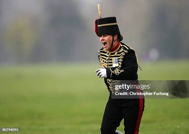 Young gunner laughs after falling from her mount during the gallop as part of a 41 gun royal salute by The Kings Troop Royal Horse Artillery in Hyde...