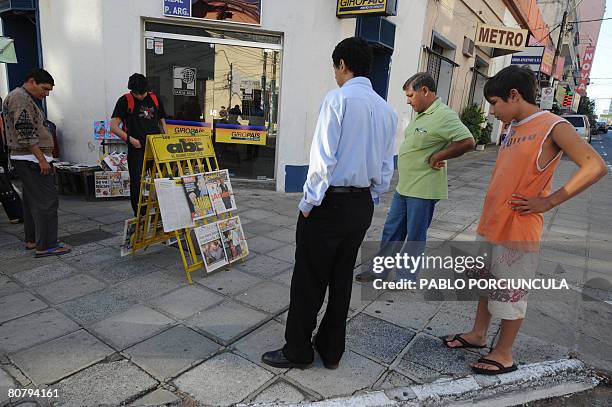 People read newspaper front pages at a newsstand in Asuncion on April 21, 2008. Leftist ex-bishop Fernando Lugo was declared the winner of the...