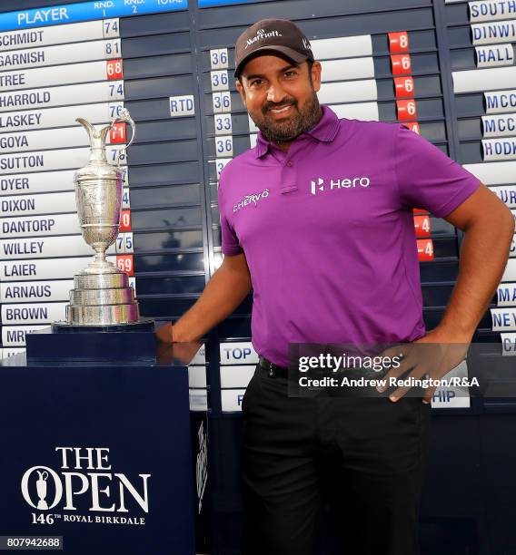 Shiv Kapur of India poses next to the claret jug after finishing at 8 under par during The Open Championship Final Qualifying at Woburn Golf Club on...