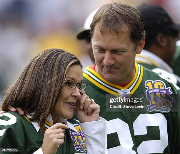 Tearful Sarah White, wife of Reggie White, is comforted by ex-Packer great Don Beebe during the unveiling of Reggie's name on the inside of the...