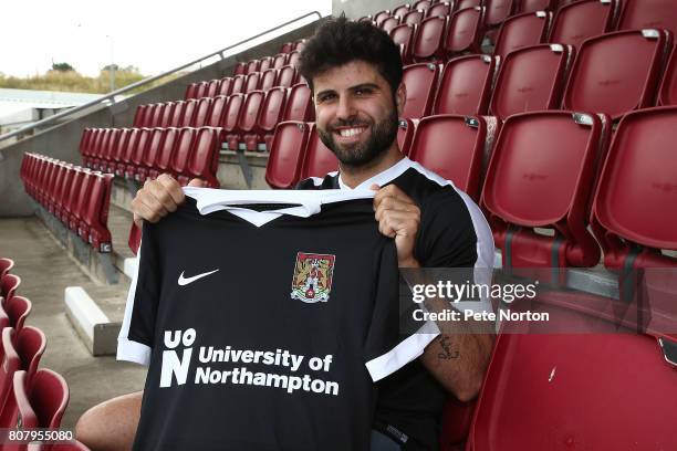Northampton Town new signing Yaser Kasim poses with a shirt in the stands at Sixfields on July 4, 2017 in Northampton, England.