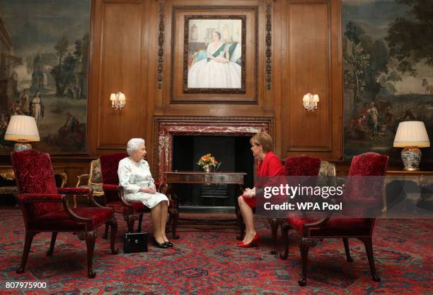 Queen Elizabeth II meets with Scotland's First Minister Nicola Sturgeon during an audience at the Palace of Holyroodhouse on July 4, 2017 in...