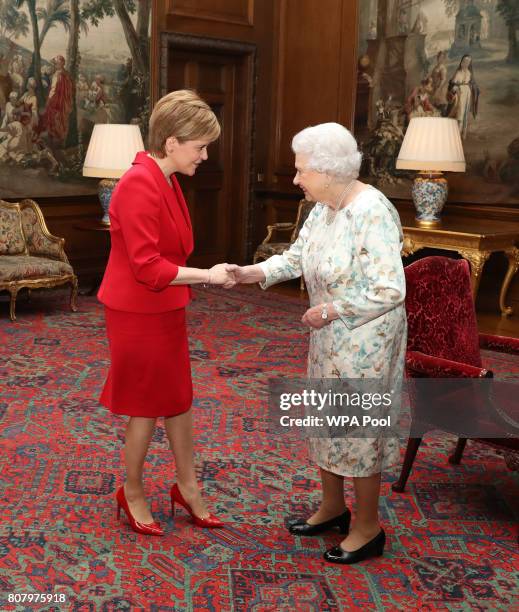 Queen Elizabeth II meets with Scotland's First Minister Nicola Sturgeon during an audience at the Palace of Holyroodhouse on July 4, 2017 in...