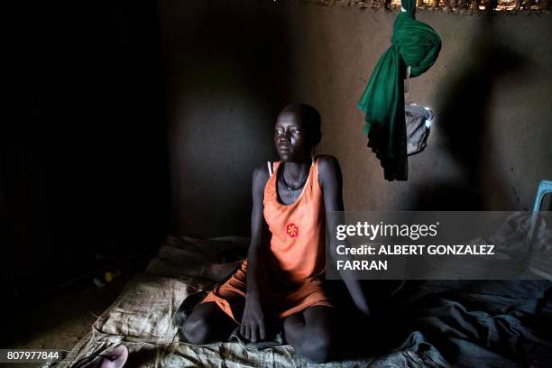 Nyachiang Dual recovers from a suspected cholera infection in a relative's house in Padding, near Lankien, Jonglei, South Sudan, on July 2, 2017....