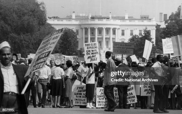 Civil rights marchers protest in front of the White House for District of Columbia Home Rule in April of 1965.