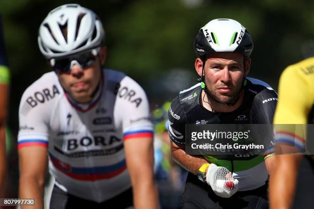 Mark Cavendish of Great Britain riding for Team Dimension Data rides in next to Juraj Sagan of Slovakia riding for Bora-Hansgrohe following stage...