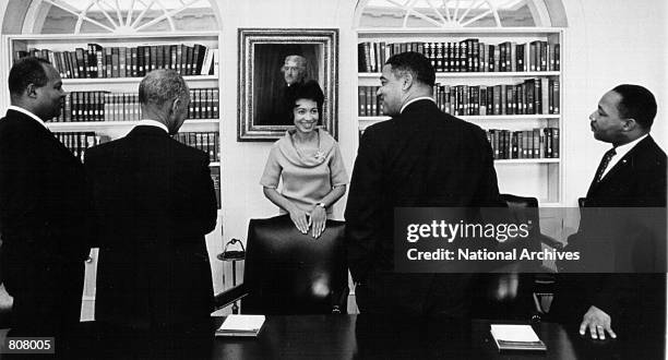Group of civil rights leaders speak with Geraldine Whittington, one of President Lyndon B. Johnson's private secretaries, before meeting with the...