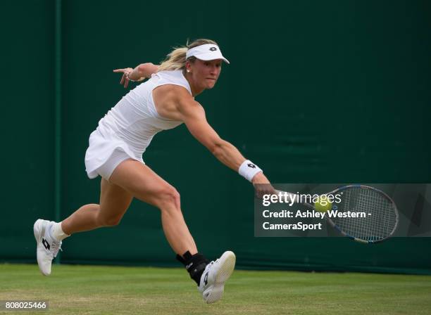 Denisa Allertova of The Czech Republic in action during her victory over Lisa Ozaki of Japan in their Ladies' Singles First Round Match at Wimbledon...