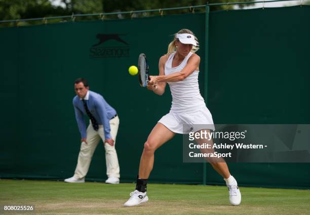 Denisa Allertova of The Czech Republic in action during her victory over Lisa Ozaki of Japan in their Ladies' Singles First Round Match at Wimbledon...