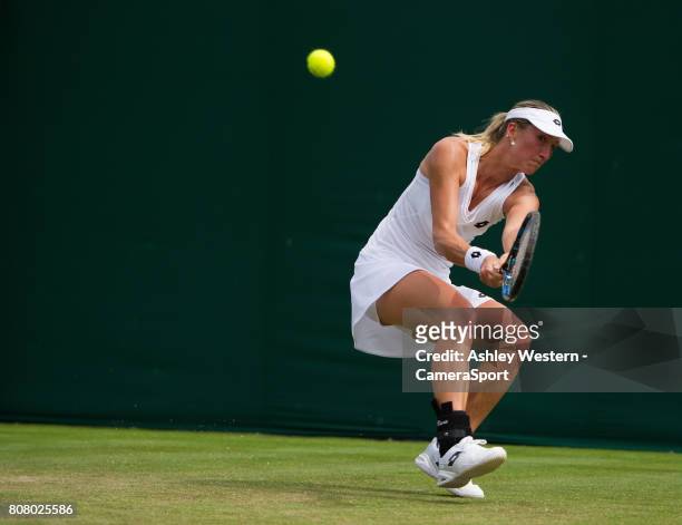 Denisa Allertova of The Czech Republic in action during her victory over Lisa Ozaki of Japan in their Ladies' Singles First Round Match at Wimbledon...