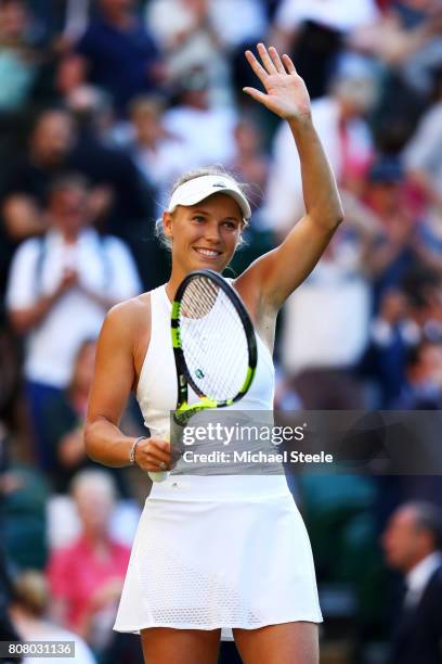 Caroline Wozniacki of Denmark celebrates victory after the Ladies Singles first round match against Timea Babos of Hungary on day two of the...