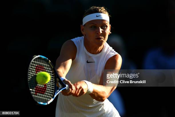 Lucie Safarova of The Czech Republic plays a forehand during the Ladies Singles first round match Oceane Dodin of France on day two of the Wimbledon...
