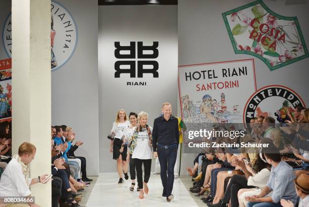 Designer aknowledge the applause of the audience at the Riani Fashion Show Spring/Summer 2018 at Umspannwerk Kreuzberg on July 4, 2017 in Berlin,...