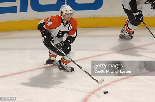 Kimmo Timonen of the Philadelphia Flyers skates with the puck during game five of the 2008 NHL Stanley Cup Playoffs Eastern Conference Quaterfinals...