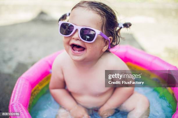 happy baby girl - baby sunglasses stock pictures, royalty-free photos & images