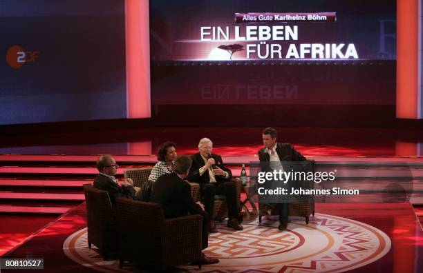 German actor Karlheinz Boehm , his wife Almaz and TV-host Markus Lanz are seen during a press conference at Bavaria Film television studios on April...