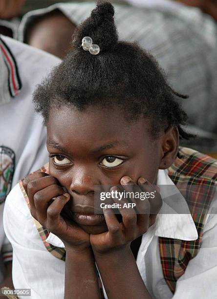 Young girl watches a dance show celebrating a donation made by an NGO to people displaced by violence at Pedro Grau school in Quibdo, department of...